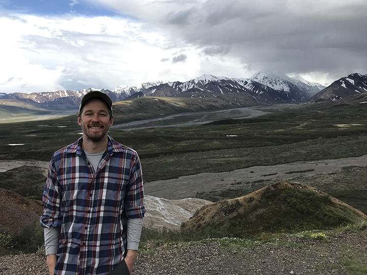 Erik Larson doing fieldwork in Alaska