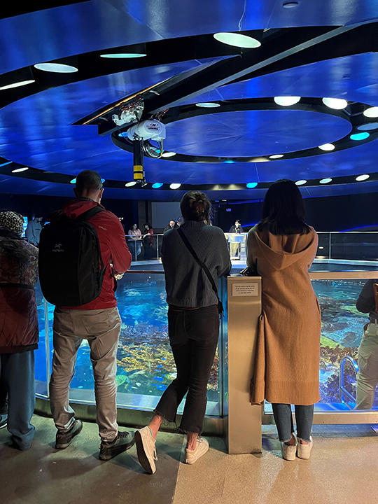 Members of the Moorcroft Lab at the top of the giant fish tank